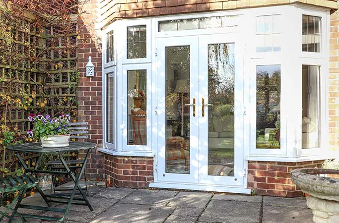 White Everest conservatory with patio doors