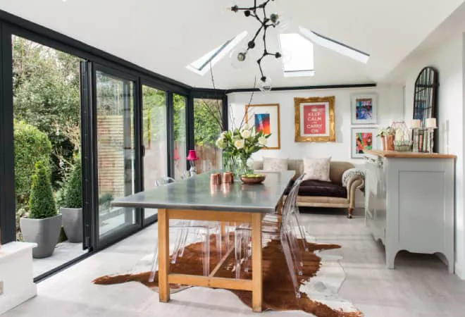 Everest conservatory dining area with dark gray bi-fold doors