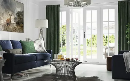 Everest conservatory with dark green curtains and white doors