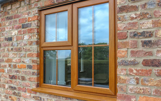 Golden Oak woodgrain uPVC window