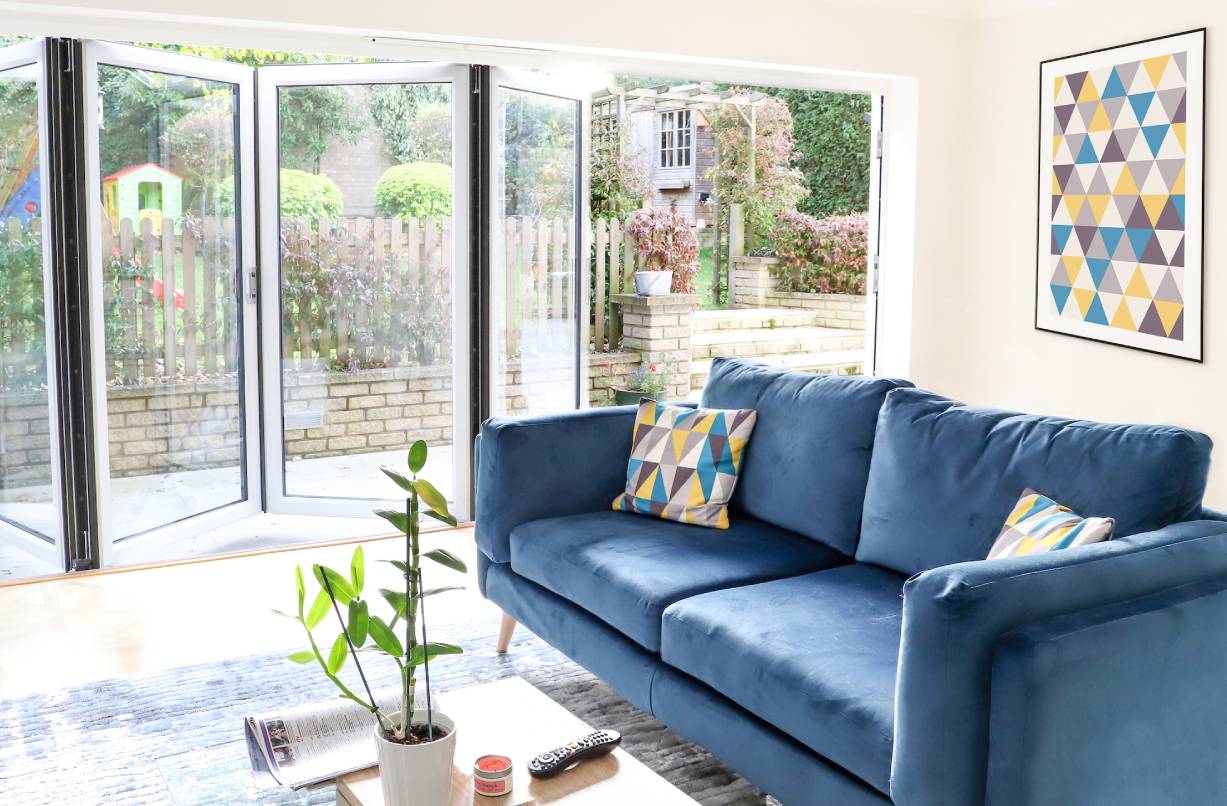 Aluminium bi-folding doors in a living room