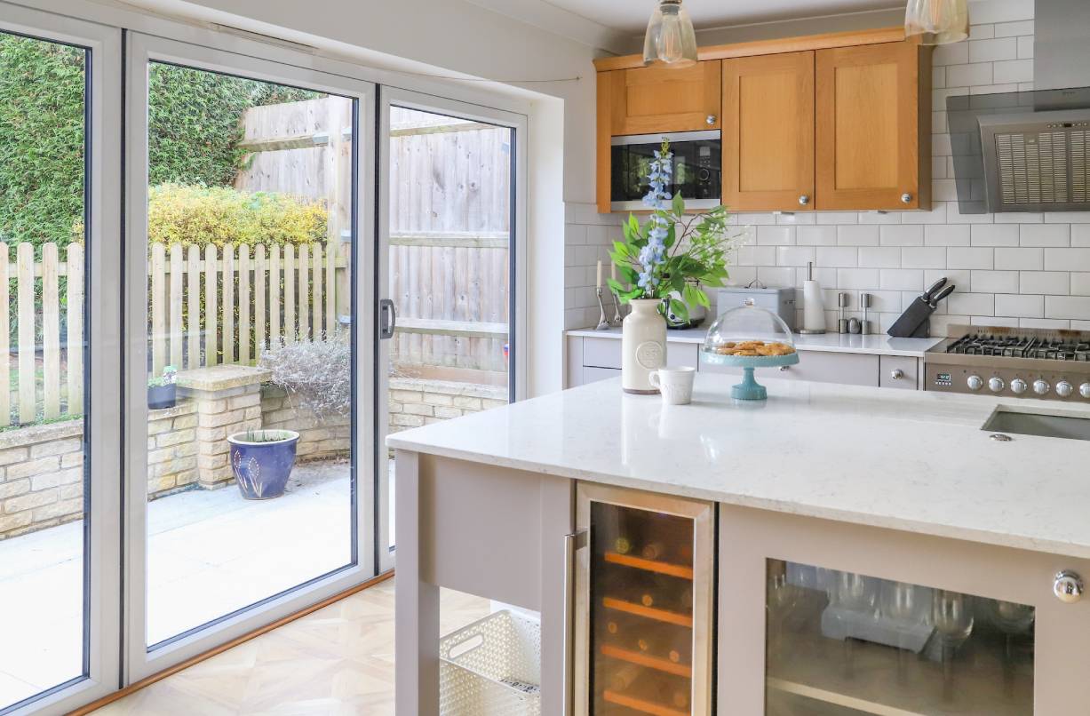 A kitchen with aluminium bi-fold doors