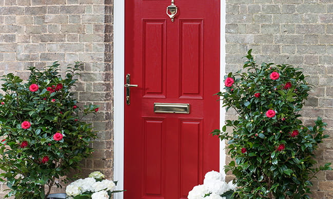 An Everest red composite entrance door