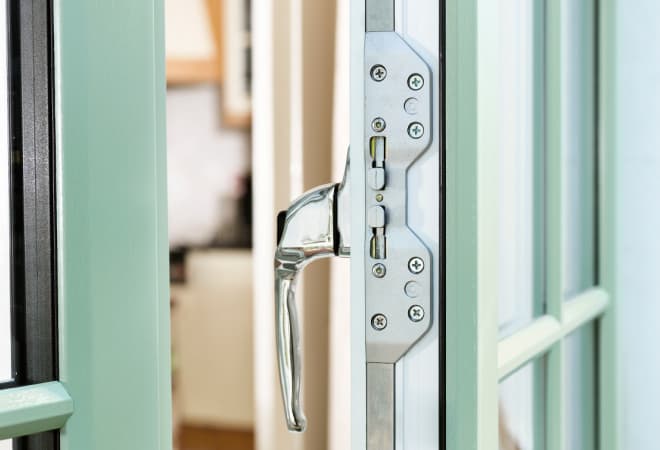 Close up of a green Everest bay window that exceeds British security standards