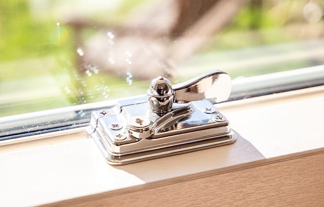 A uPVC sash window with chrome furniture