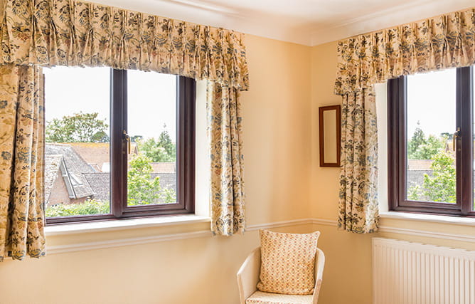 Rosewood finished uPVC casement windows inside a room