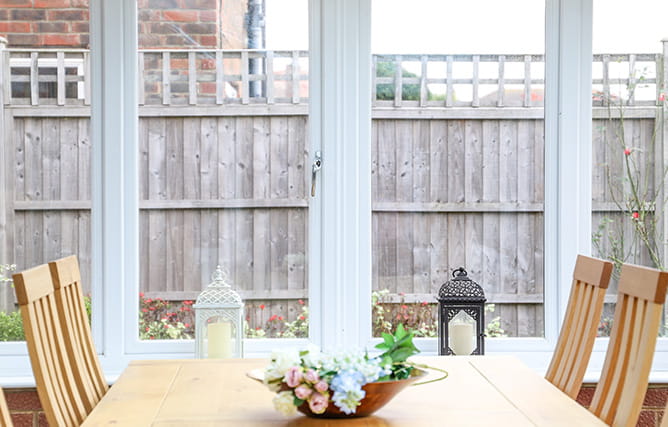 An extension with large uPVC windows with chrome handles