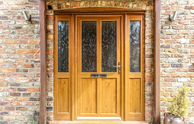 Golden oak uPVC entrance door with glazing