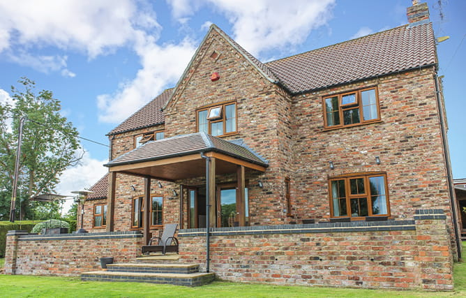 Rosewood finished uPVC casement windows inside a room