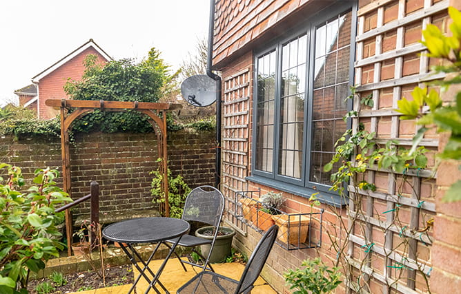 Aluminium window with leaded glass at the back of a property