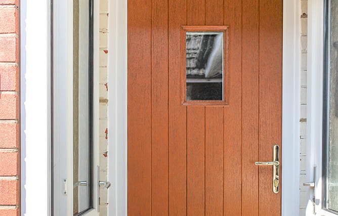 Composite entrance door in golden oak