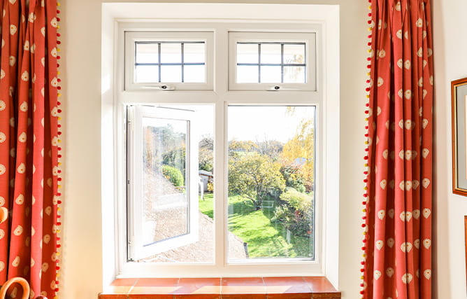 A white uPVC casement window with one side opened