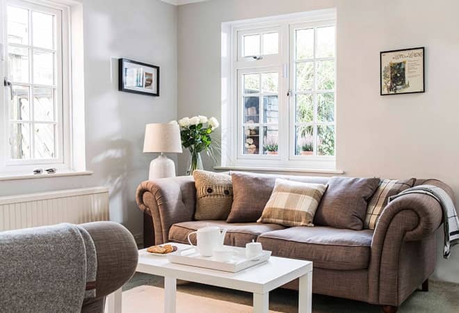 Everest white upvc windows viewed from the interior of a contemporary furnished living room