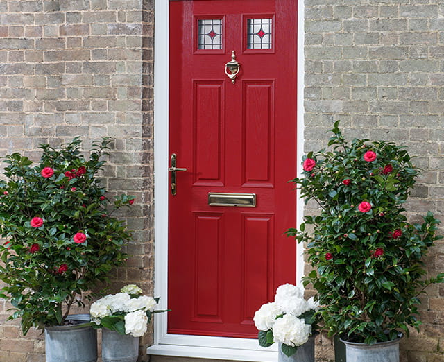 Door knocker on a red door