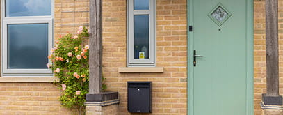 Decorative glass panel on a composite entrance door