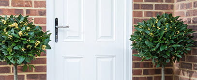 Decorative glazing pane on a white front door