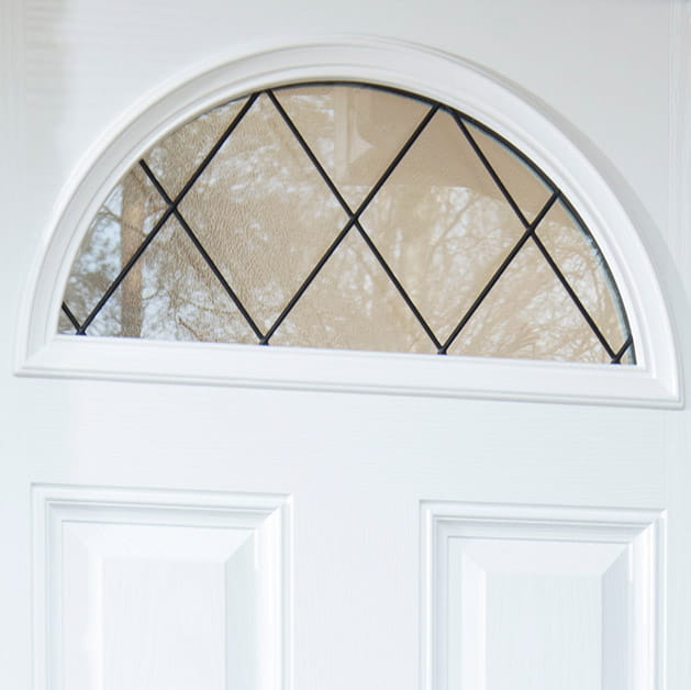 Decorative glazing pane on a white front door