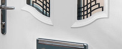 Close up view of a white composite front door