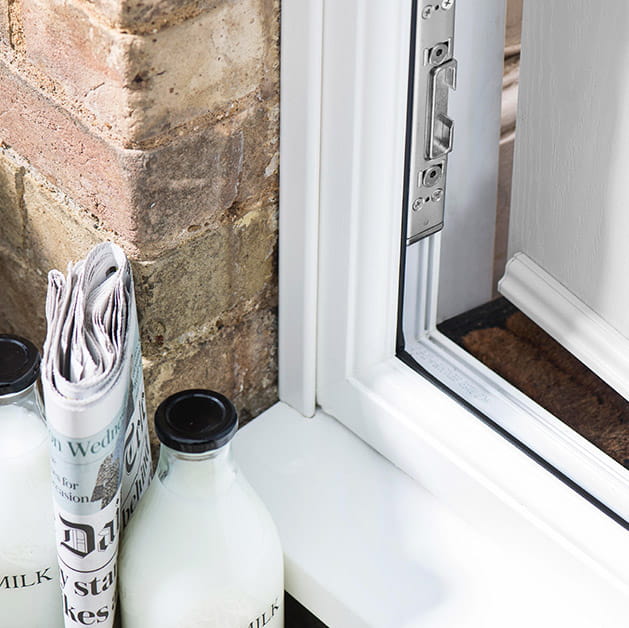 Close up view of a white composite front door