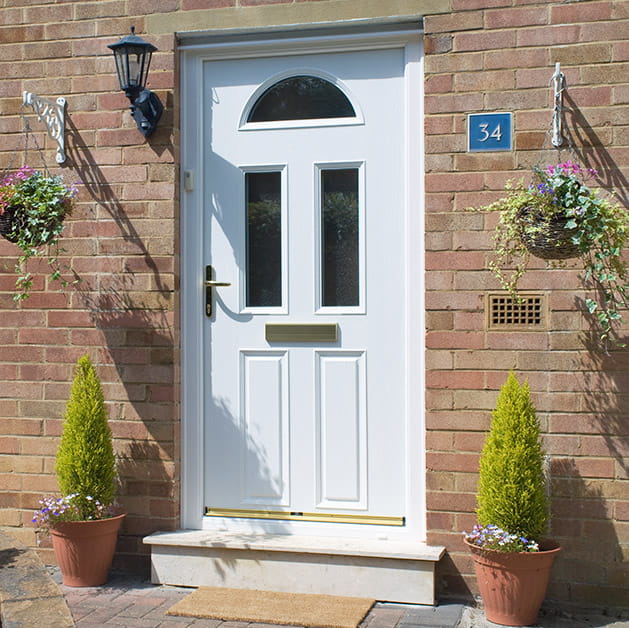 An Everest white entrance door with glazing