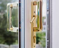 White patio doors with gold handle