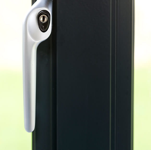 Chrome handle on a black aluminium window