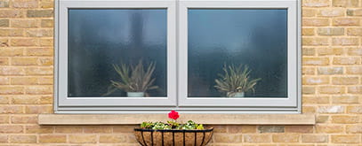 An open grey uPVC window