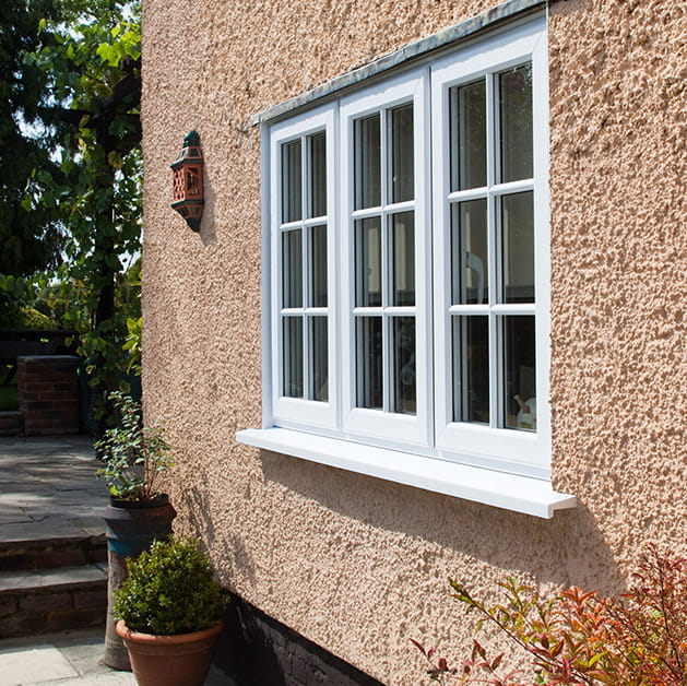 Cottage with white uPVC windows