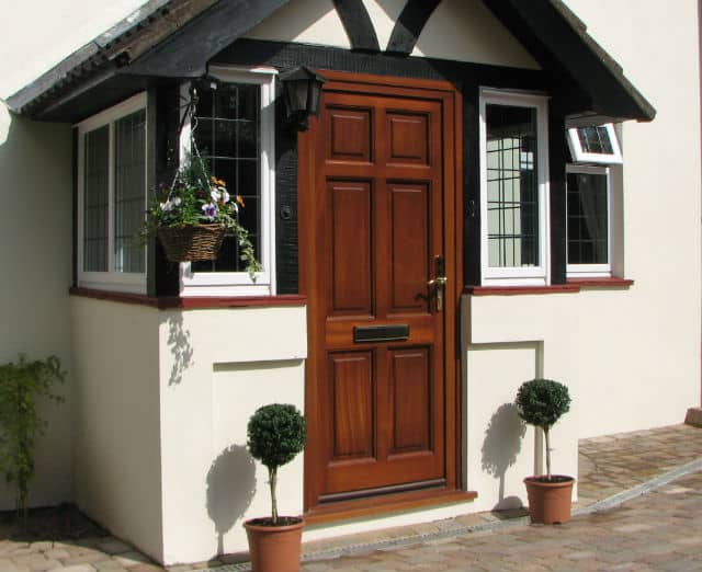 Knocker on a light oak entrance door