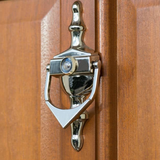 Knocker on a light oak entrance door