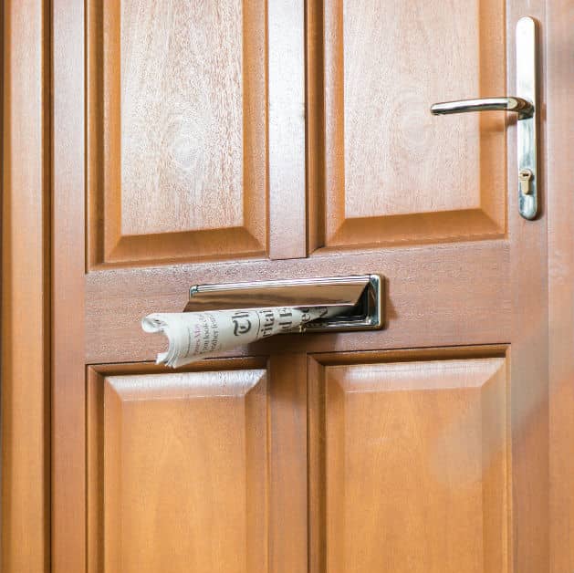 Close up of a light oak front wooden door