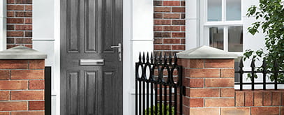 A grey painted timber front door