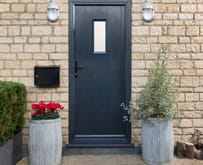 Chrome handle on an anthracite grey front door