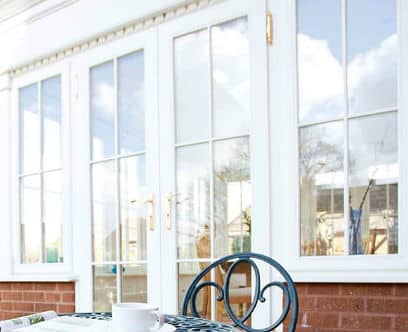 White wooden doors on a conservatory