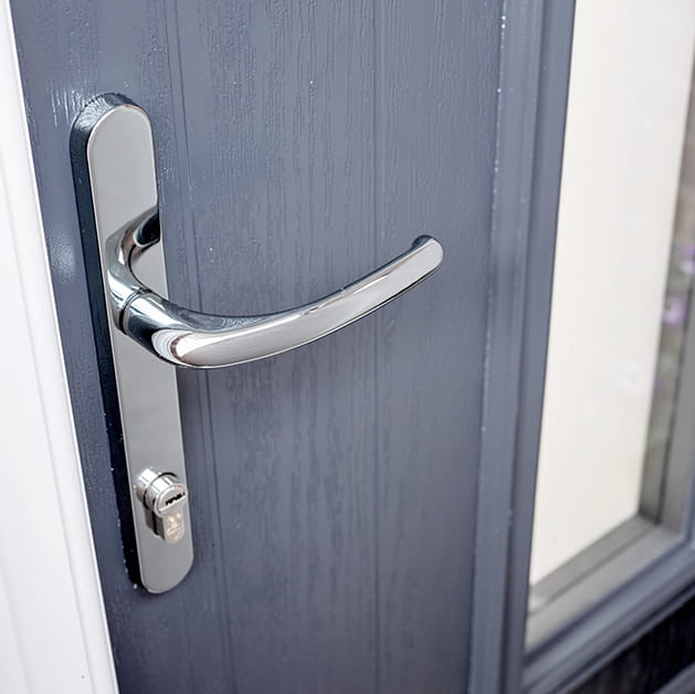 Chrome handle on an anthracite grey front door