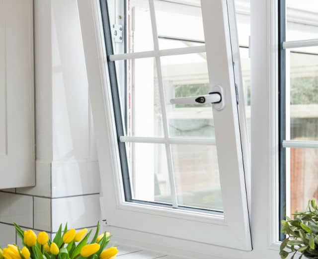 Close up of a white Everest uPVC tilt and turn window in an open position