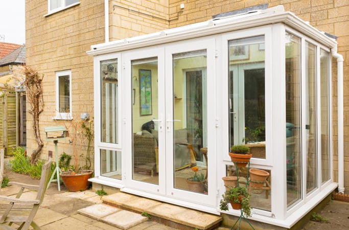 White Everest conservatory with glass doors and windows