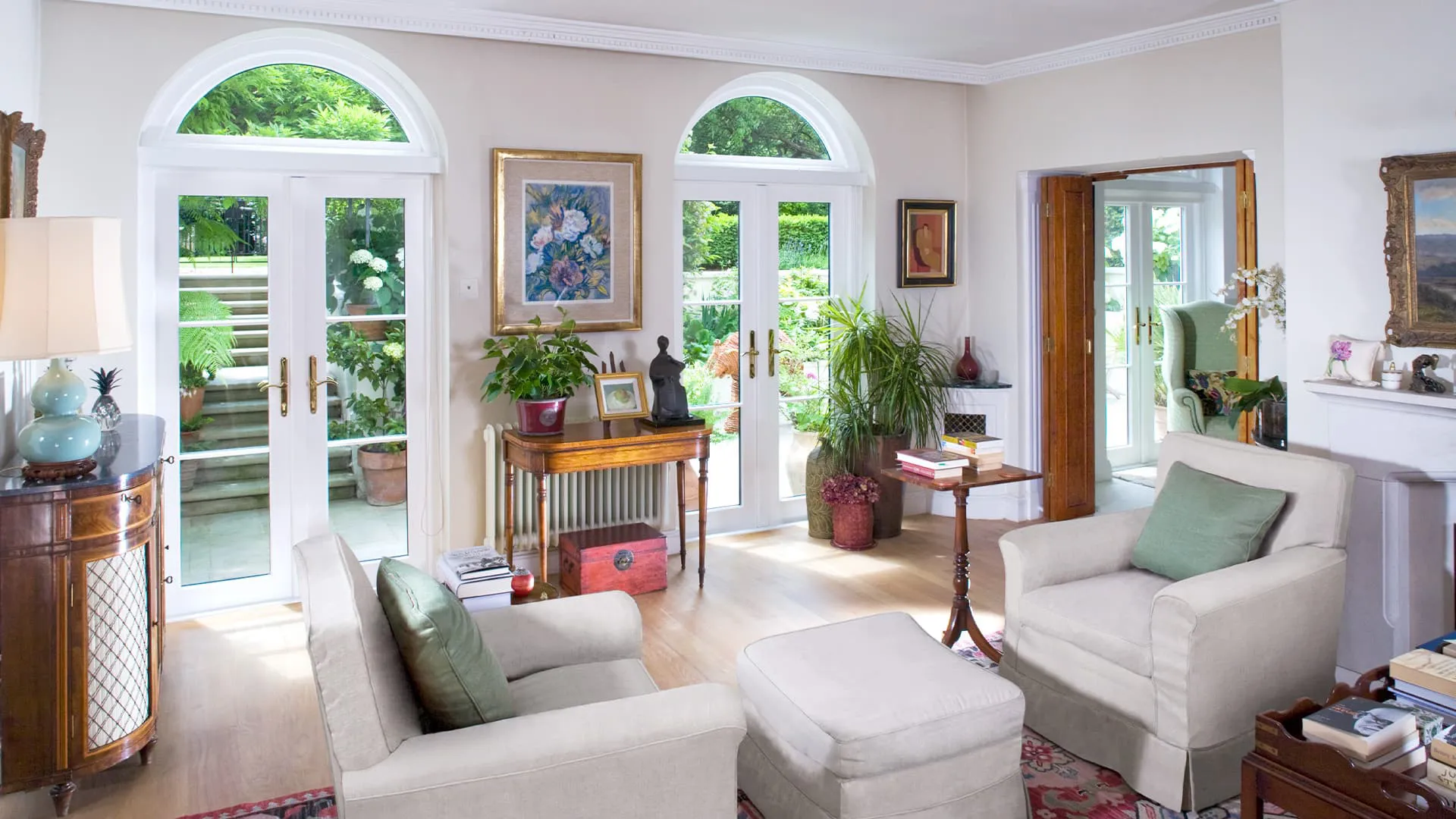 Cream coloured Everest conservatory living room with arched windows