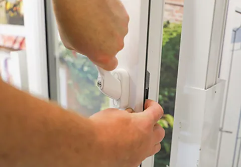 Person adjusting Everest conservatory window handle