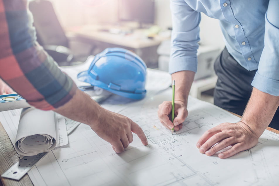 Architects reviewing building plans