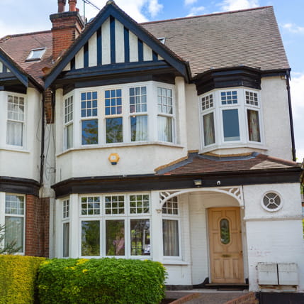 White bay windows on a traditional house