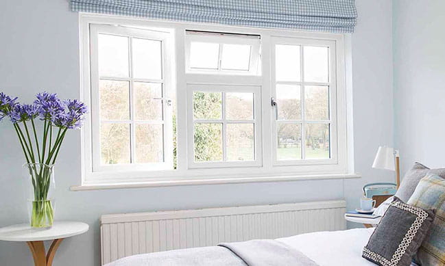 White Everest conservatory window with blue gingham blinds