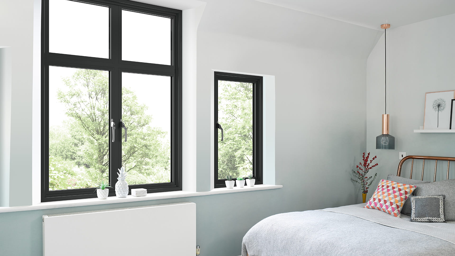 Black framed windows in a light grey room