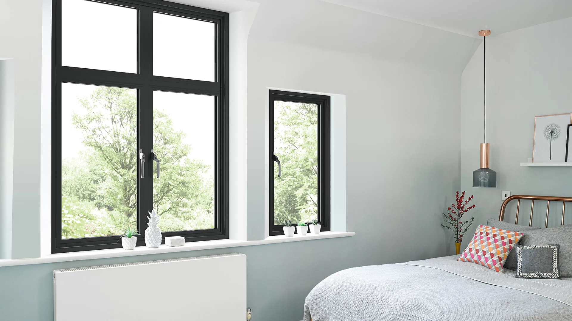Black framed windows in a light grey room