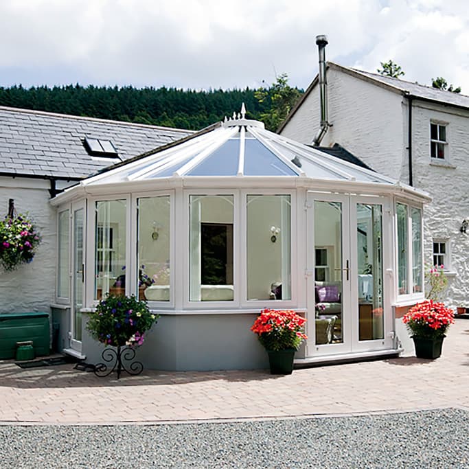 White Everest conservatory with glass roof and windows
