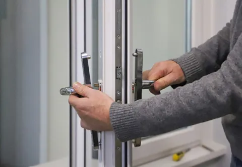 Person opening Everest conservatory door handle