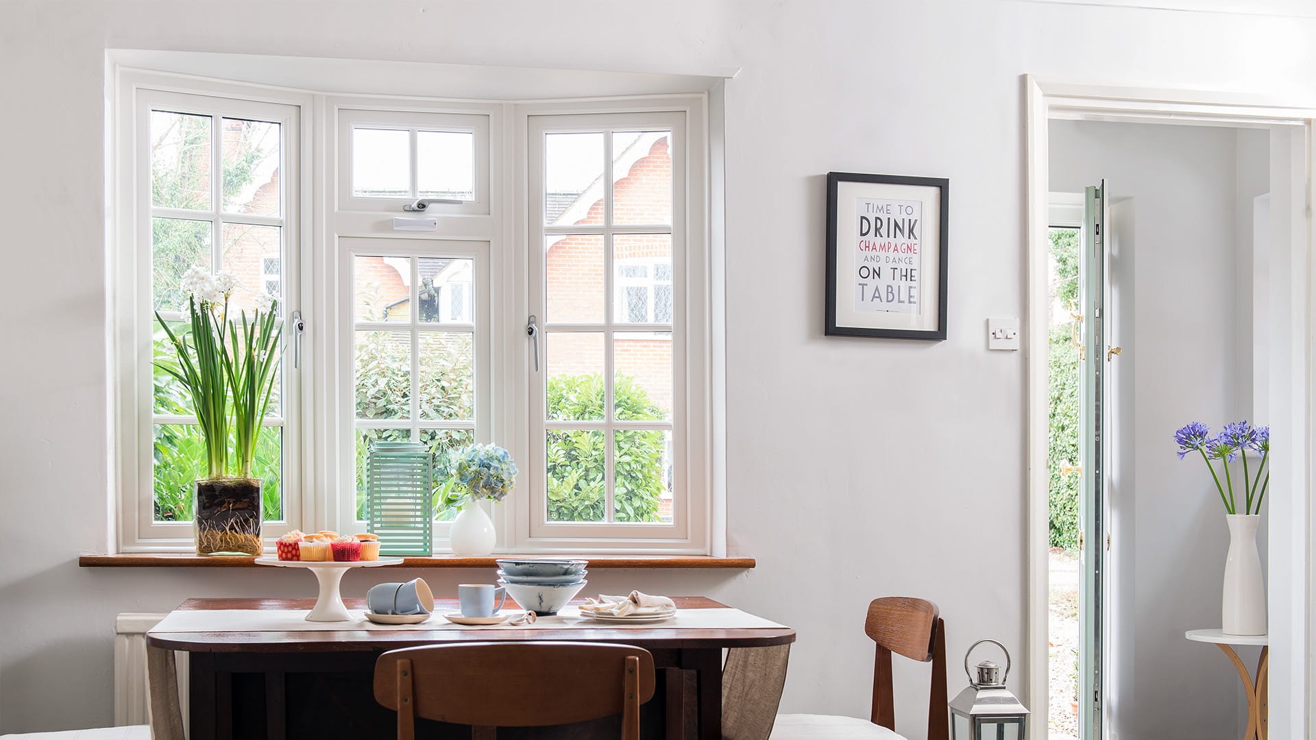 White Everest conservatory window with plants and a view