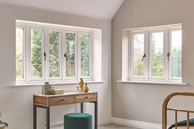 White Everest conservatory windows with a view of trees