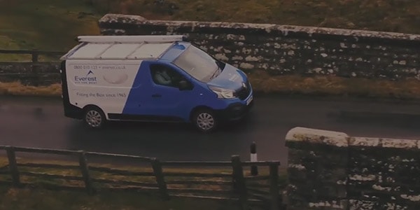 Everest van driving on a country road
