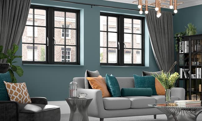 Everest conservatory with black windows and teal and beige accents